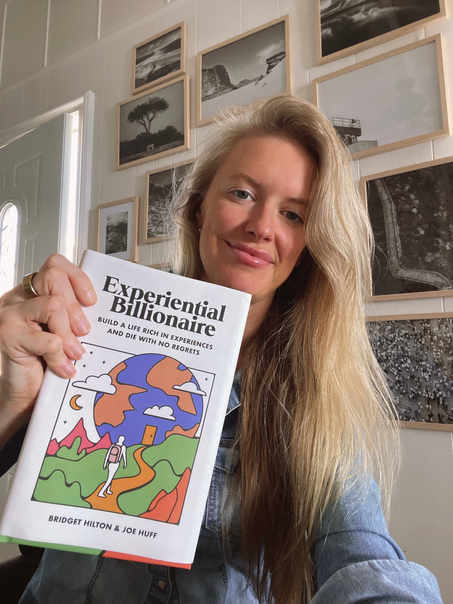 Bridget Hilton holding Experiential Billionaire