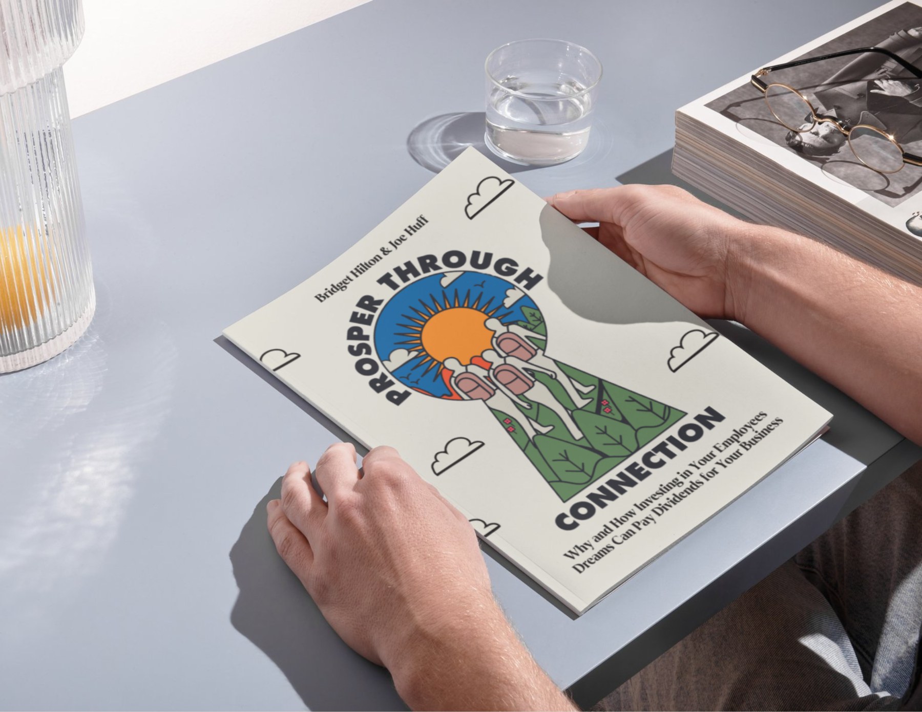Reader holding the Prosper Through Connection toolkit